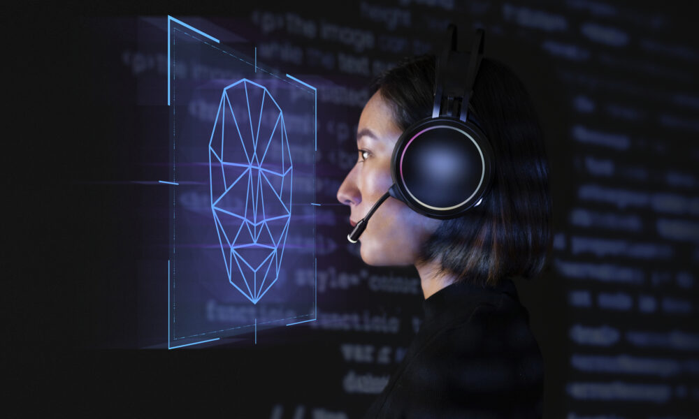 female-programmer-scanning-her-face-with-biometric-security-technology-virtual-screen-digital-remix-1000x600-2