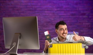 front-view-office-worker-sitting-his-working-place-with-tickets-passport-bag-1000x600-2