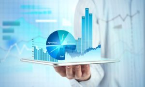 Close,View,Of,Businessman,With,Tablet,And,Graphs,And,Charts
