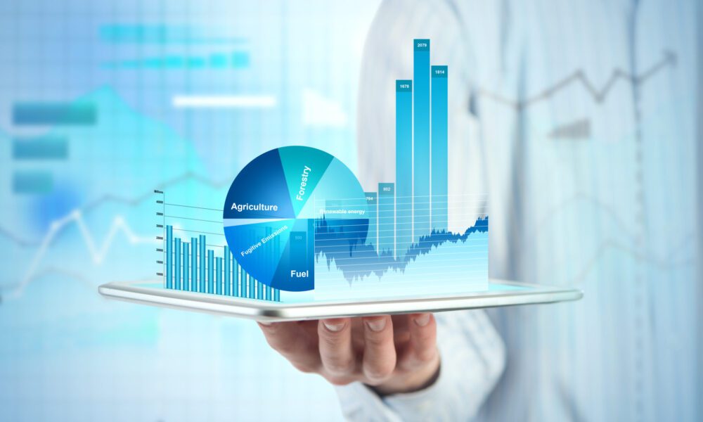 Close,View,Of,Businessman,With,Tablet,And,Graphs,And,Charts